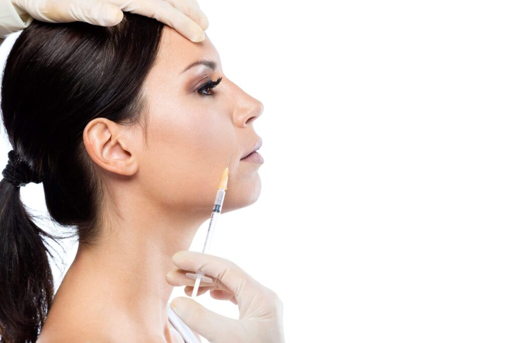 HOW LONG DOES BOTOX TAKE TO WORK? 7 beautiful young woman getting botox cosmetic injection her face scaled